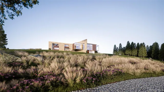 a view of a field with an ocean view