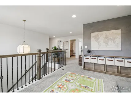 a spacious bedroom with a bed and a window