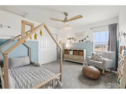 a bedroom with bed and window