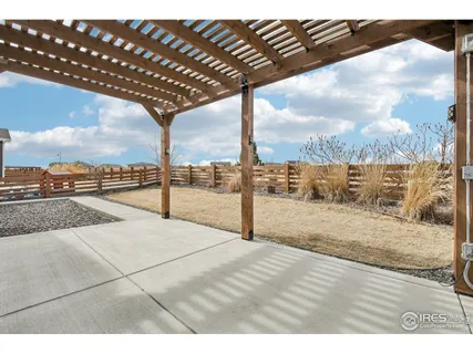 an aerial view of a residential houses with outdoor space