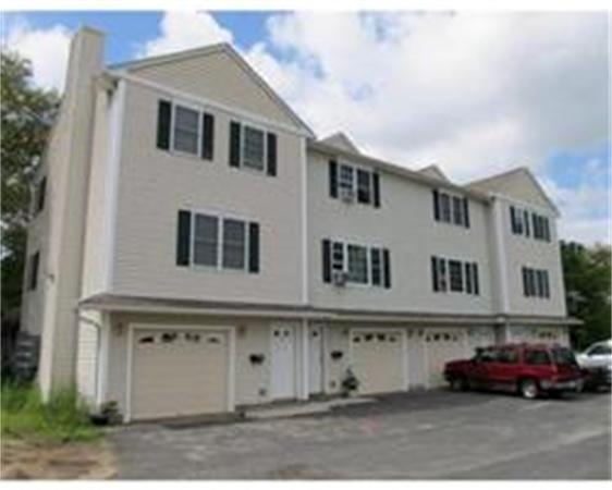 153-159 White Street Springfield, MA 01108 - Photo 1 of 8 a front view of a house with a parking space