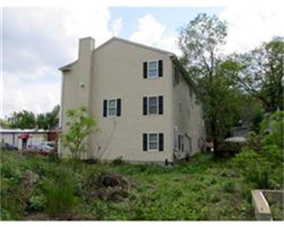 153-159 White Street Springfield, MA 01108 - Photo 2 of 8 a view of a house with backyard and garden