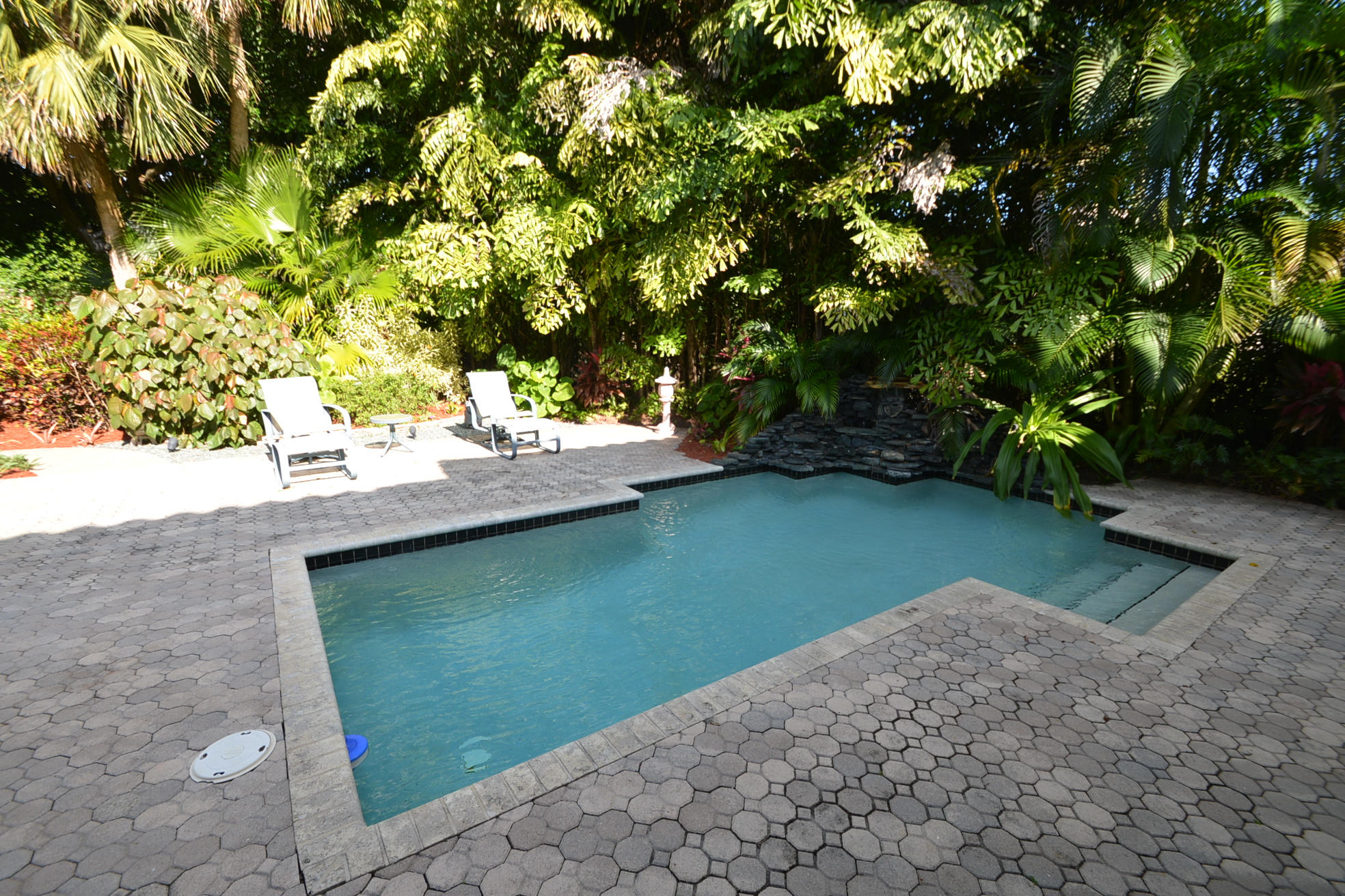 6390 Northwest 24th Avenue Boca Raton, FL 33496 - Photo 25 of 32 a view of a lake with a tree