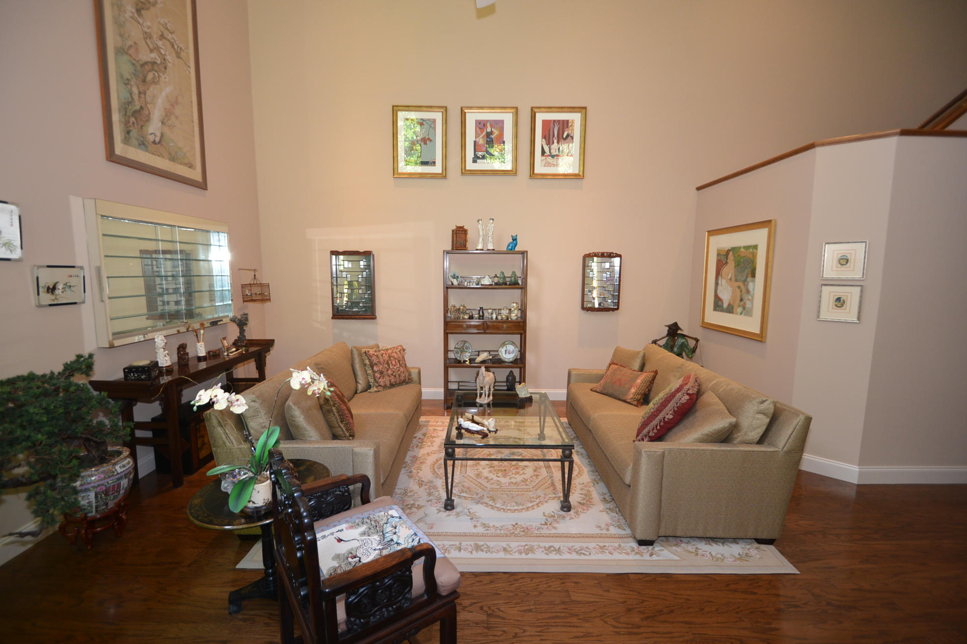 6390 Northwest 24th Avenue Boca Raton, FL 33496 - Photo 7 of 32 a living room with furniture potted plant and a wooden floor