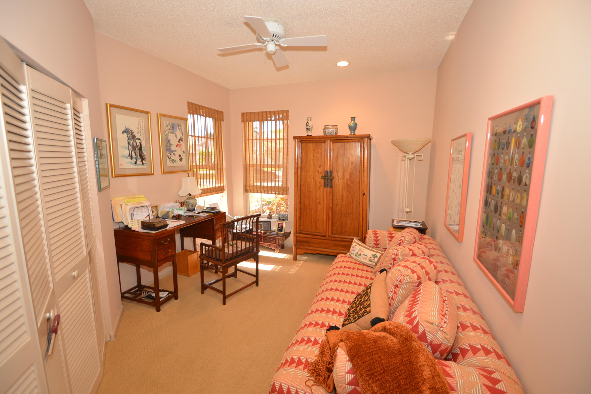 6390 Northwest 24th Avenue Boca Raton, FL 33496 - Photo 10 of 32 a bed room with a bed and a chair
