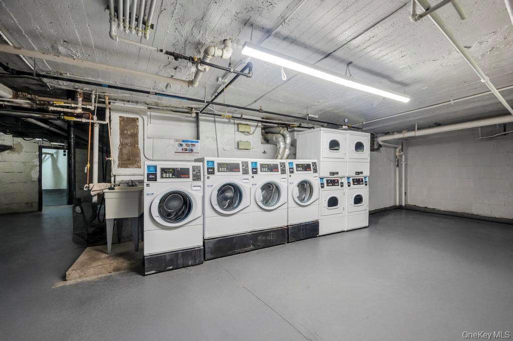 2020 East 41st Street, Unit 2B Brooklyn, NY 11234 - Photo 15 of 17 a utility room with dryer and washer
