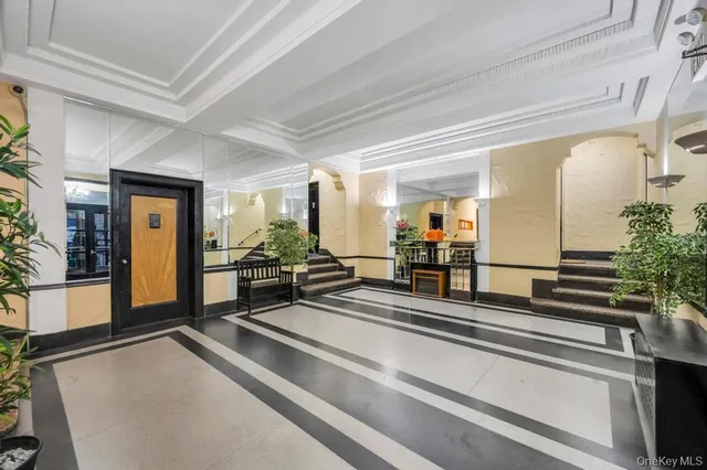 a lobby with furniture and window