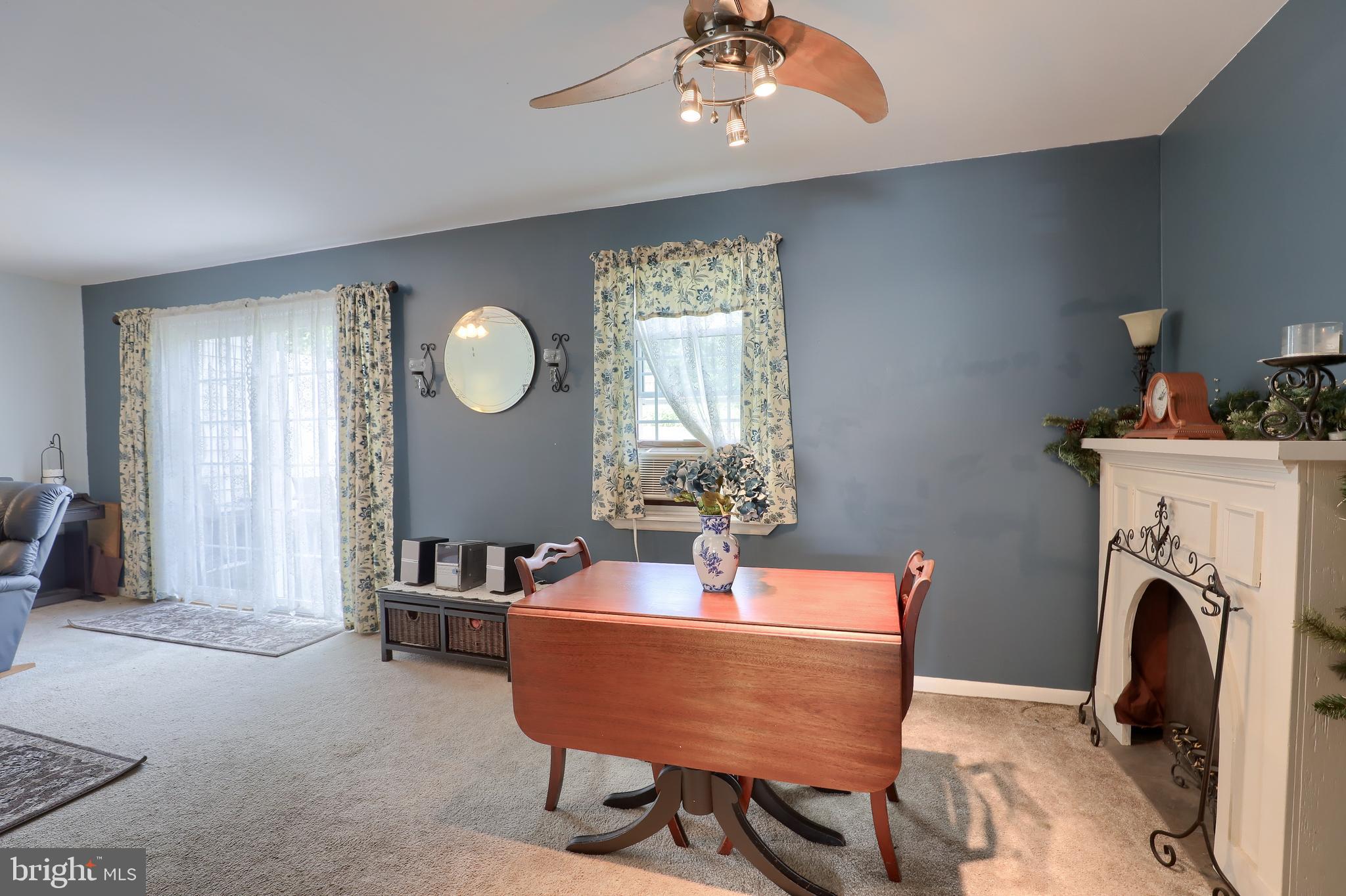 465 Crosswinds Drive Lititz, PA 17543 - Photo 13 of 30 a room with furniture a fireplace and a chandelier