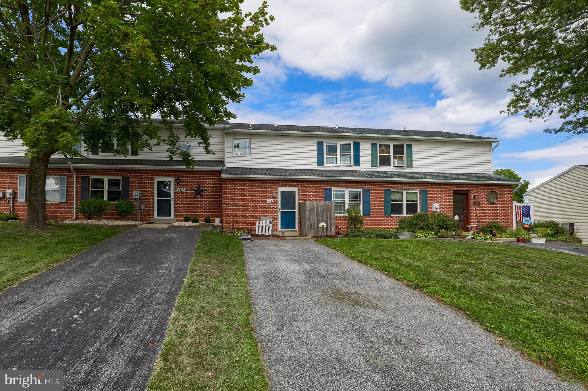 465 Crosswinds Drive Lititz, PA 17543 - Photo 2 of 30 front view of a brick house with a yard