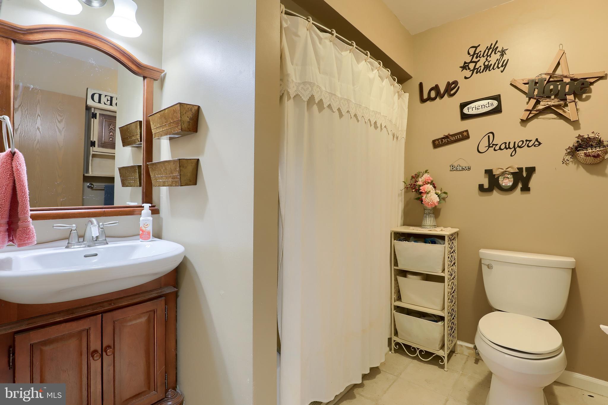465 Crosswinds Drive Lititz, PA 17543 - Photo 25 of 30 a bathroom with a toilet sink and mirror