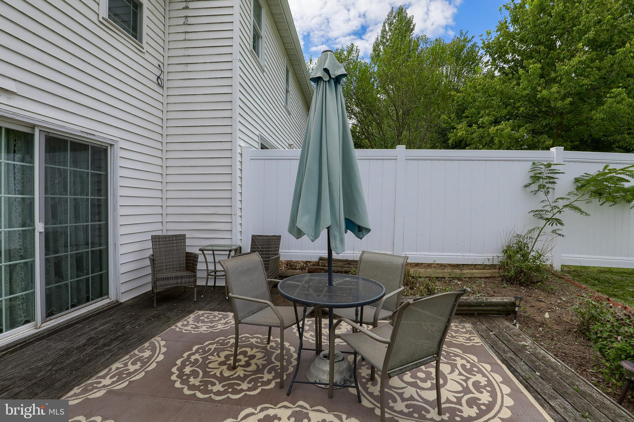 465 Crosswinds Drive Lititz, PA 17543 - Photo 27 of 30 a backyard of a house with table and chairs