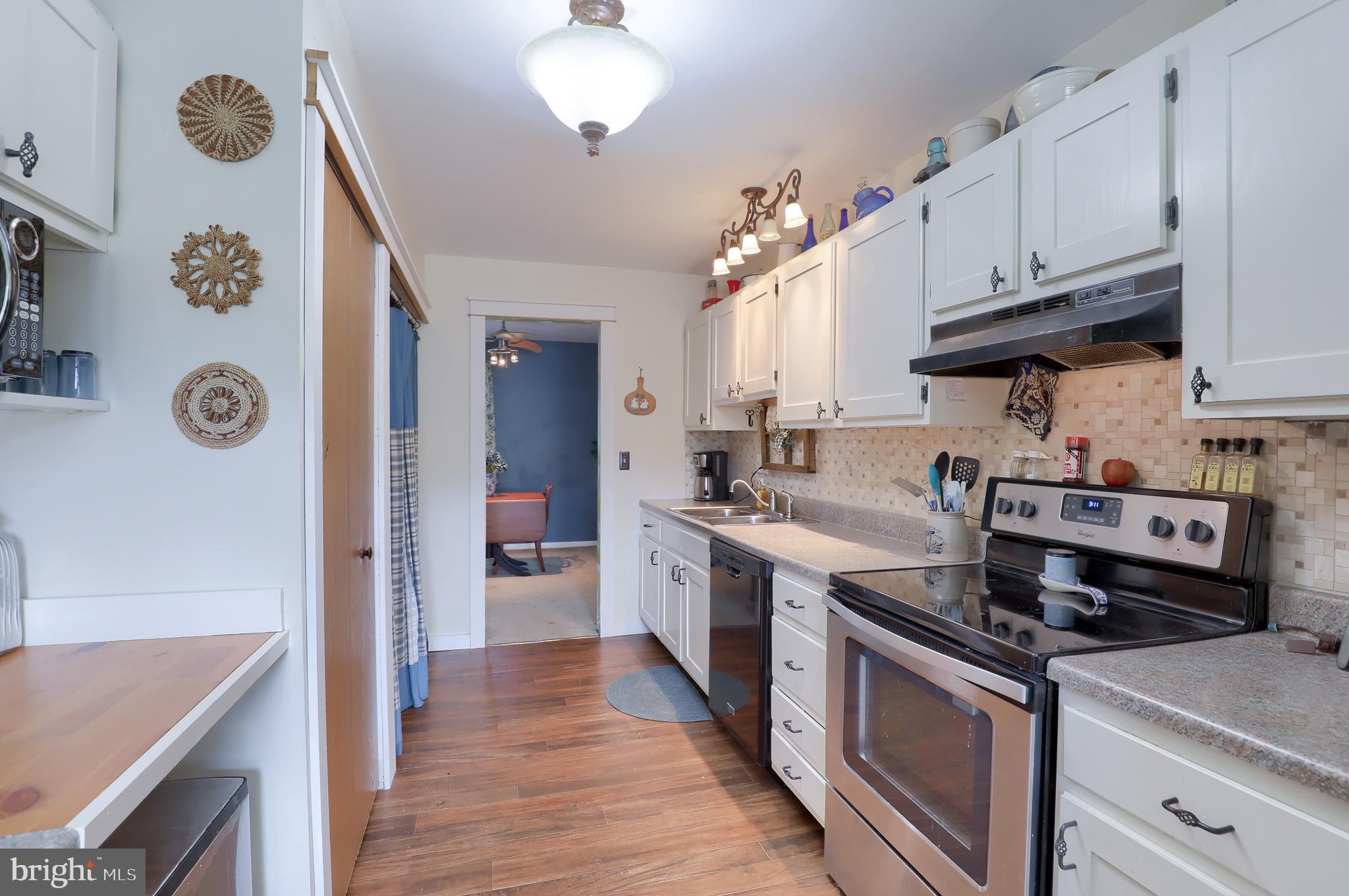 465 Crosswinds Drive Lititz, PA 17543 - Photo 6 of 30 a kitchen with a stove and a refrigerator