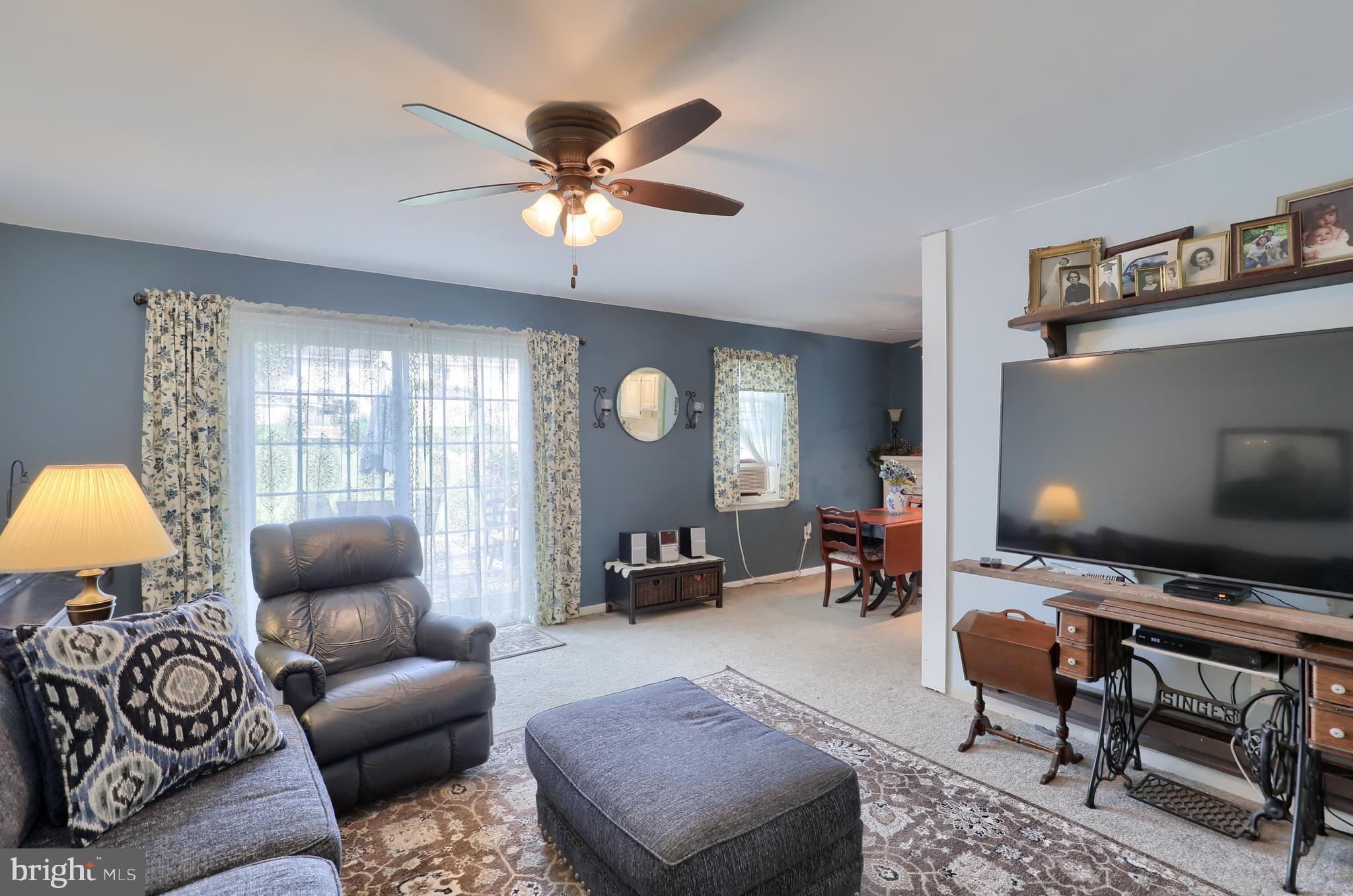465 Crosswinds Drive Lititz, PA 17543 - Photo 10 of 30 a living room with furniture a ceiling fan and a window