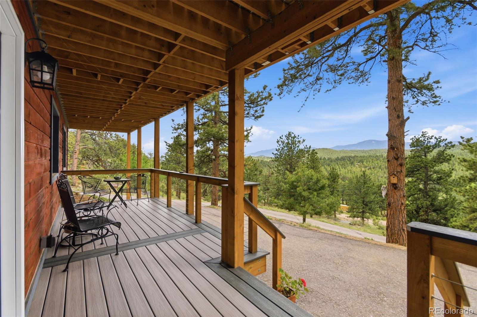 202 Badger Lane Bailey, CO 80421 - Photo 3 of 50 a view of balcony with wooden floor