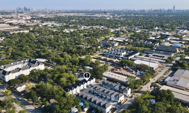 an aerial view of city and lake