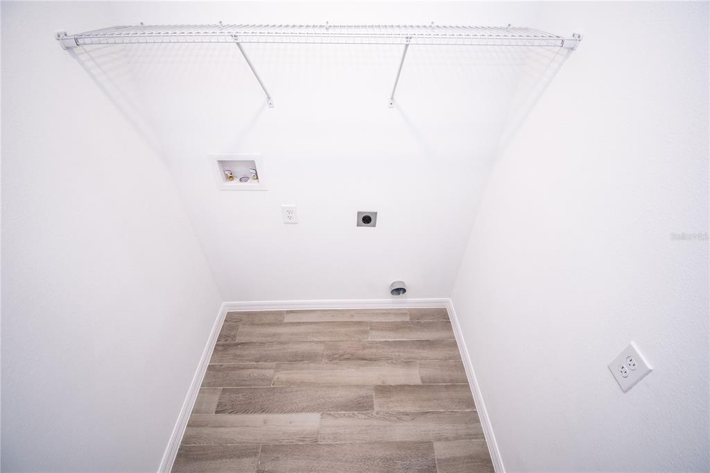 947 Conch Road Davenport, FL 33896 - Photo 14 of 20 a view of a room with racks on the wall