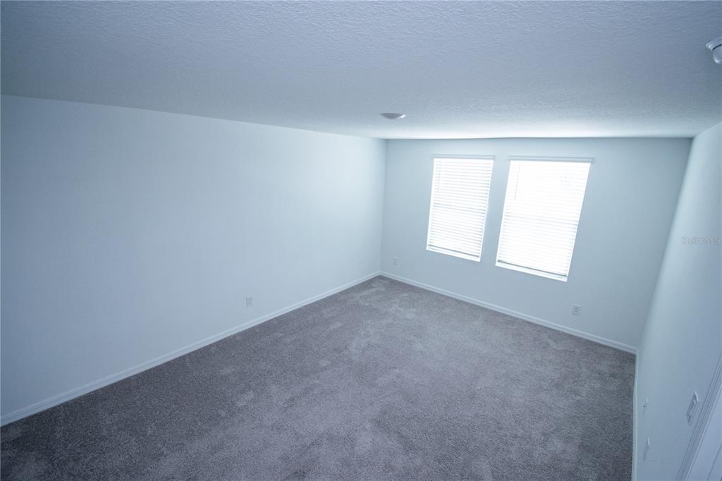 947 Conch Road Davenport, FL 33896 - Photo 16 of 20 an empty room with windows