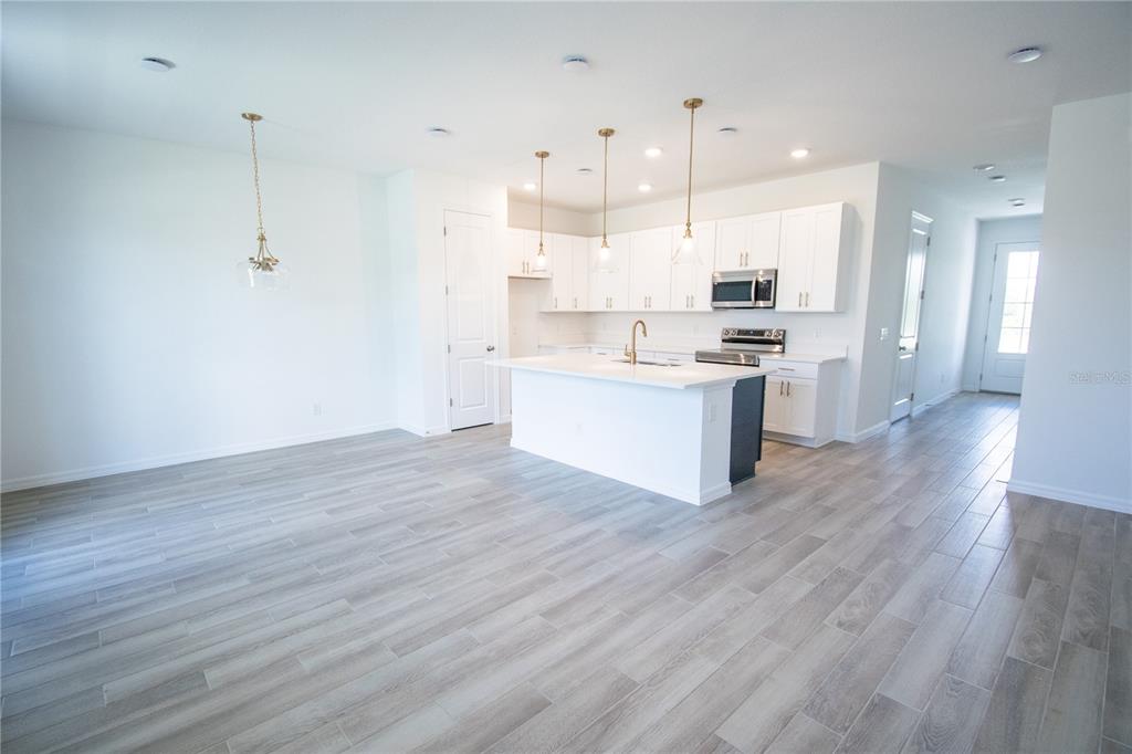 947 Conch Road Davenport, FL 33896 - Photo 3 of 20 a view of kitchen with wooden floor