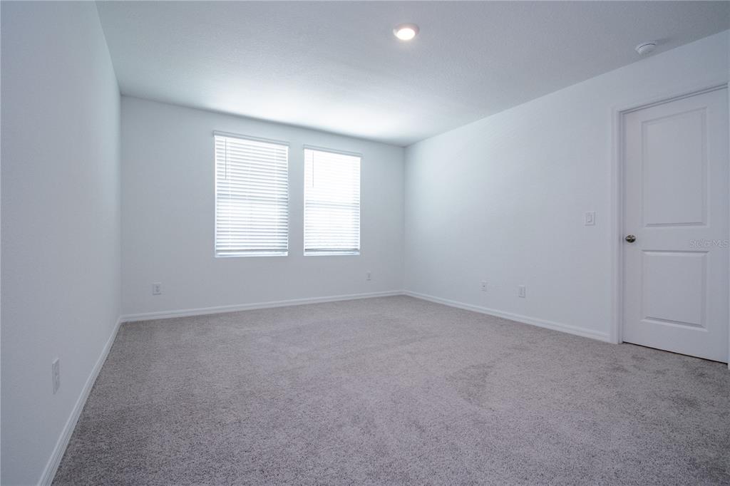 947 Conch Road Davenport, FL 33896 - Photo 7 of 20 an empty room with a window