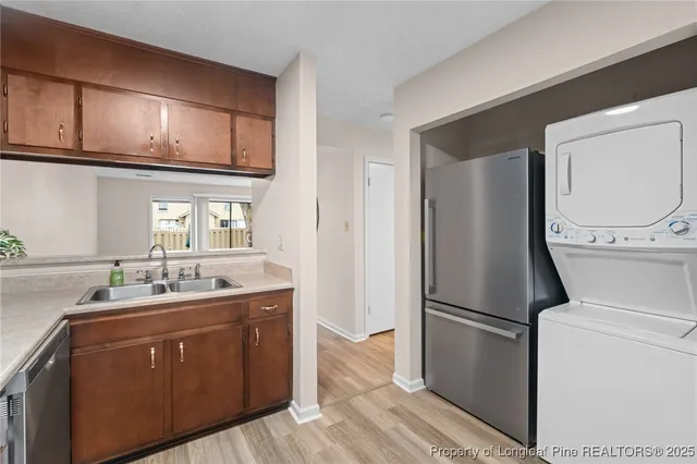 an empty room with windows and mirror