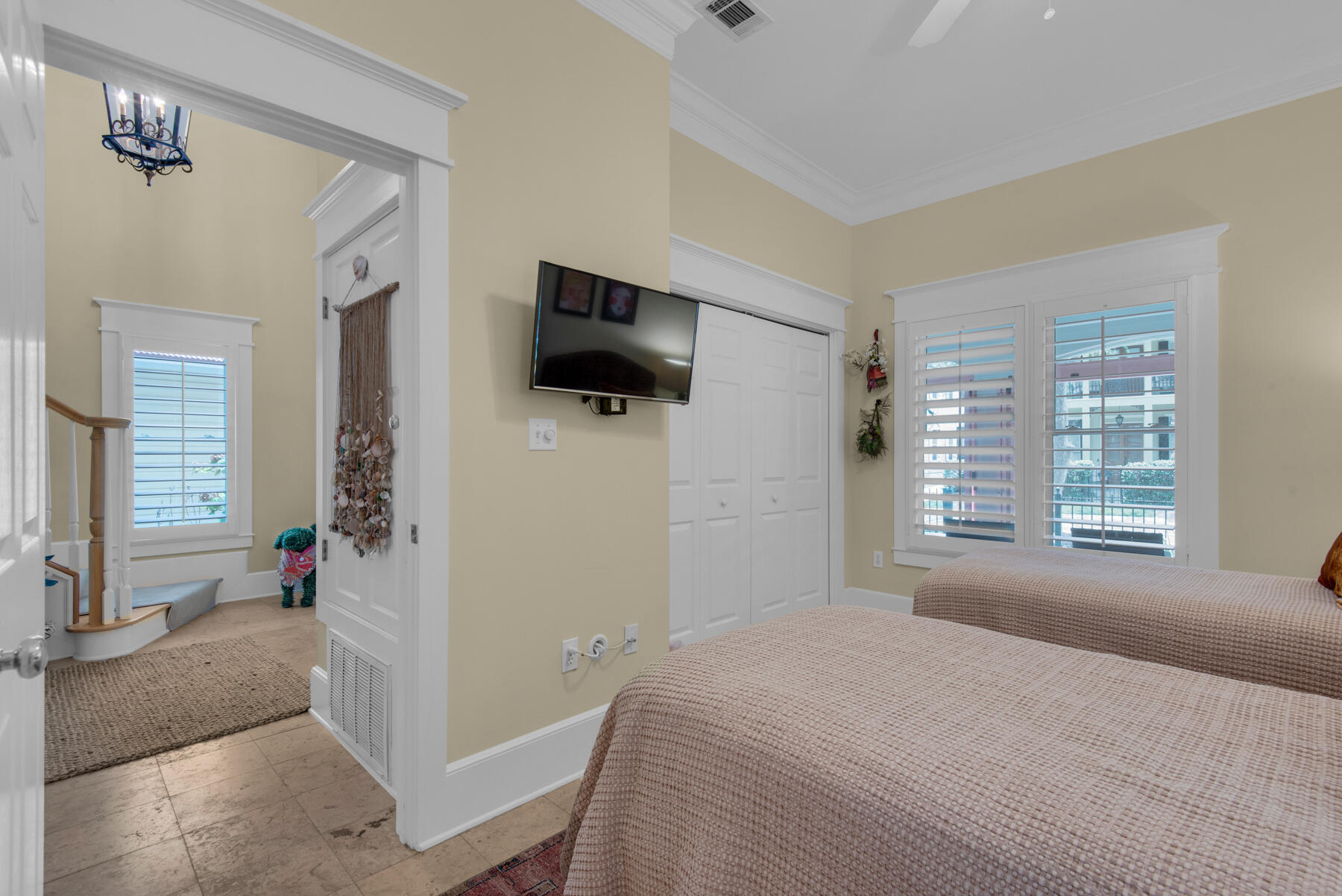 61 Rue Caribe Miramar Beach, FL 32550 - Photo 19 of 69 a bedroom with a bed and a flat tv screen on the dresser