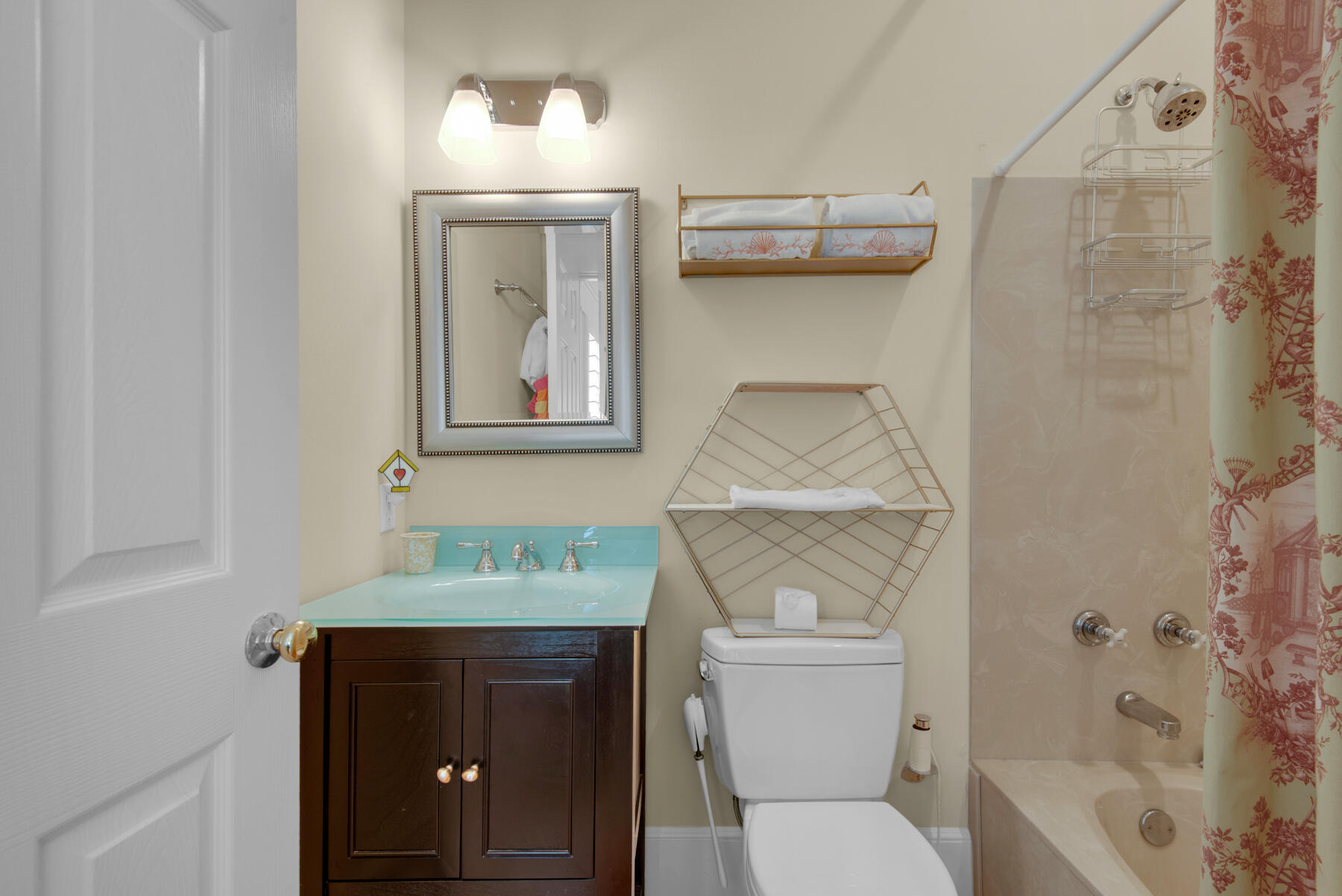 61 Rue Caribe Miramar Beach, FL 32550 - Photo 36 of 69 a bathroom with a toilet sink and mirror