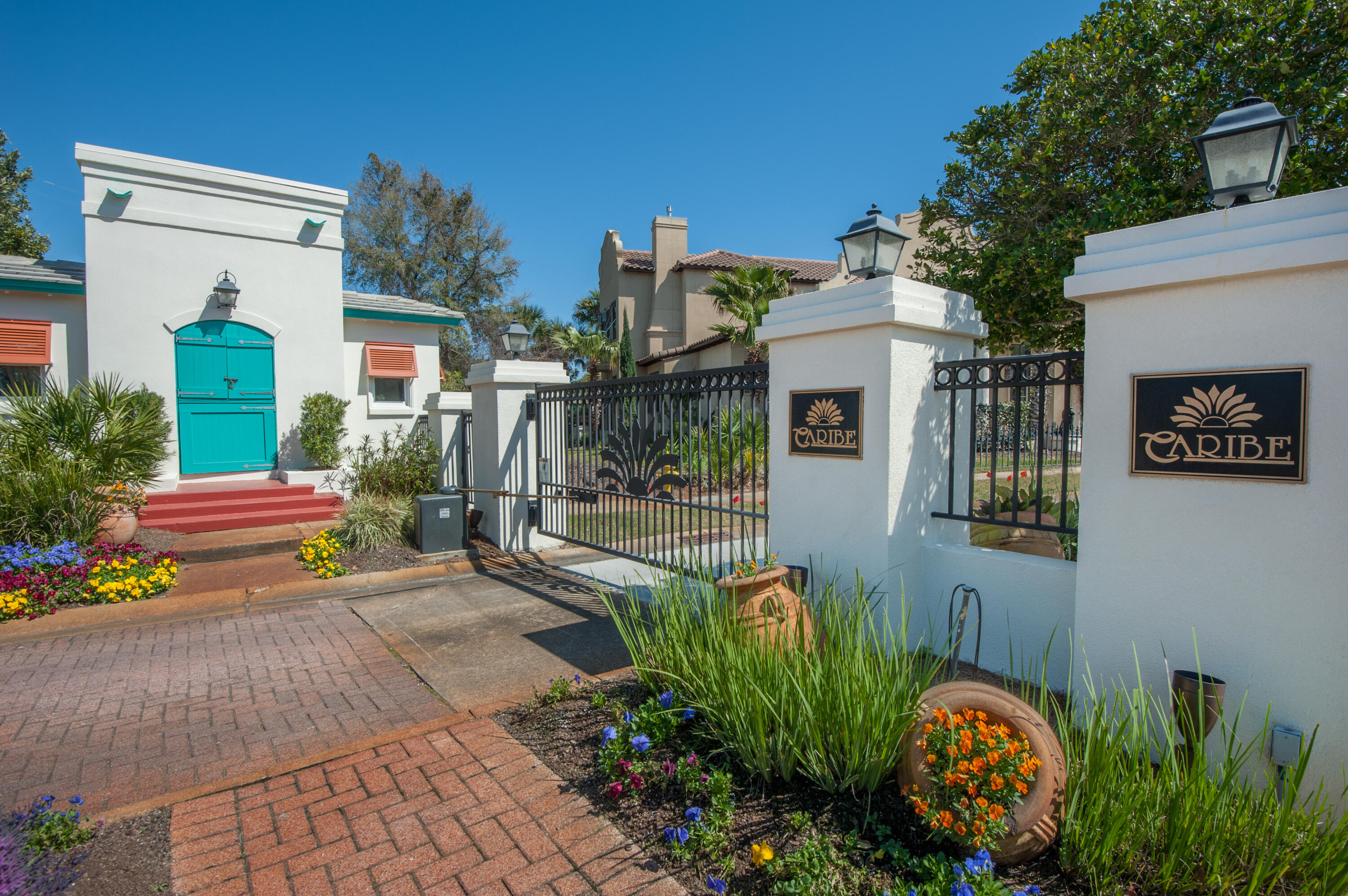 61 Rue Caribe Miramar Beach, FL 32550 - Photo 51 of 69 a view of a street with potted plants and large tree