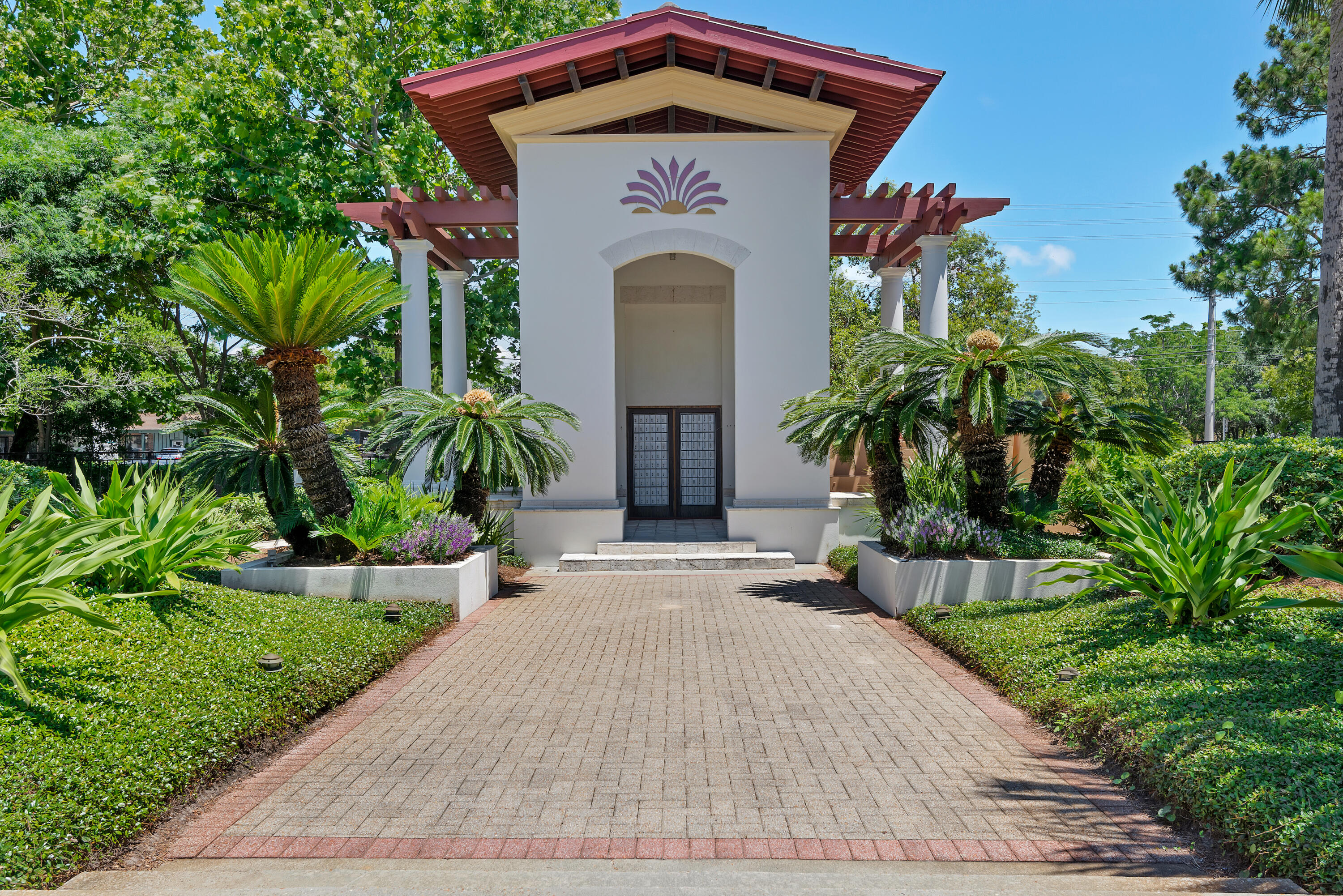 61 Rue Caribe Miramar Beach, FL 32550 - Photo 55 of 69 a front view of a house with a garden