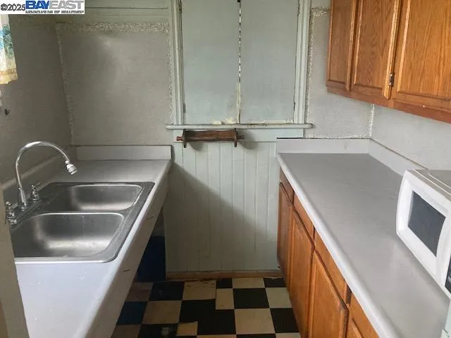 a kitchen with a sink and cabinets
