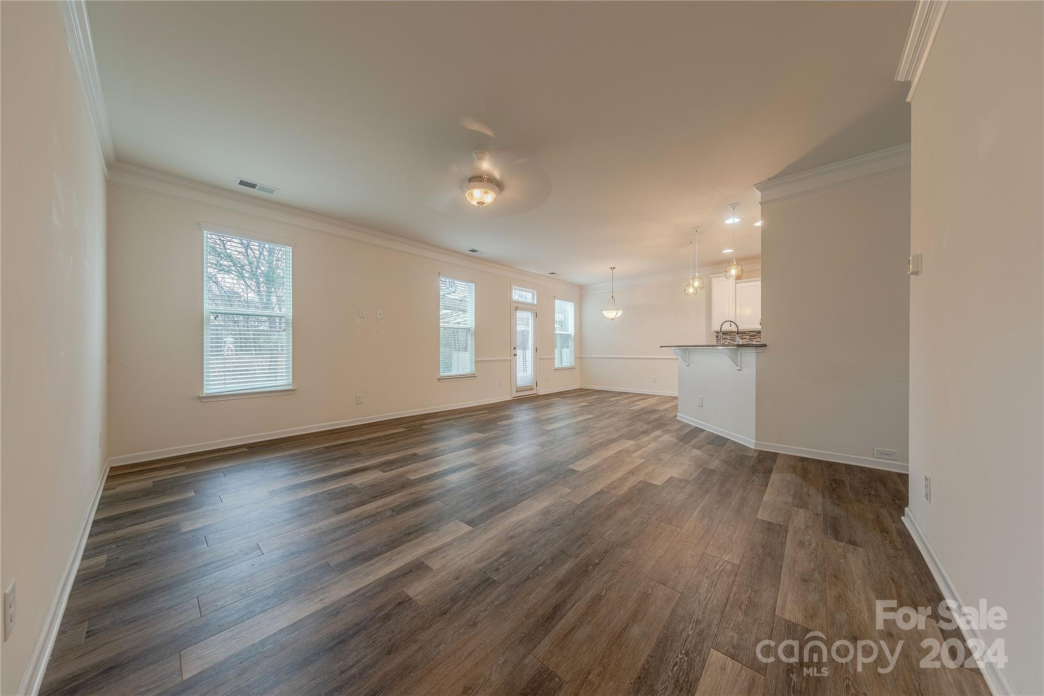 9604 Steele Meadow Road Charlotte, NC 28273 - Photo 8 of 46 a view of empty room with wooden floor and window