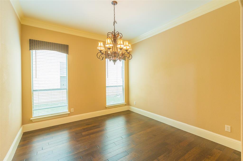 7804 Keechie Drive McKinney, TX 75070 - Photo 13 of 39 a view of empty room with wooden floor and fan