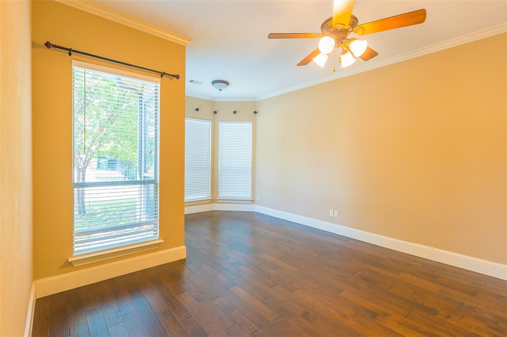 7804 Keechie Drive McKinney, TX 75070 - Photo 18 of 39 a view of an empty room with wooden floor and a window