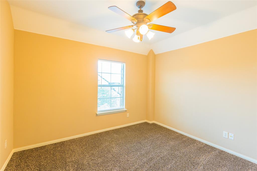 7804 Keechie Drive McKinney, TX 75070 - Photo 28 of 39 an empty room with windows and fan