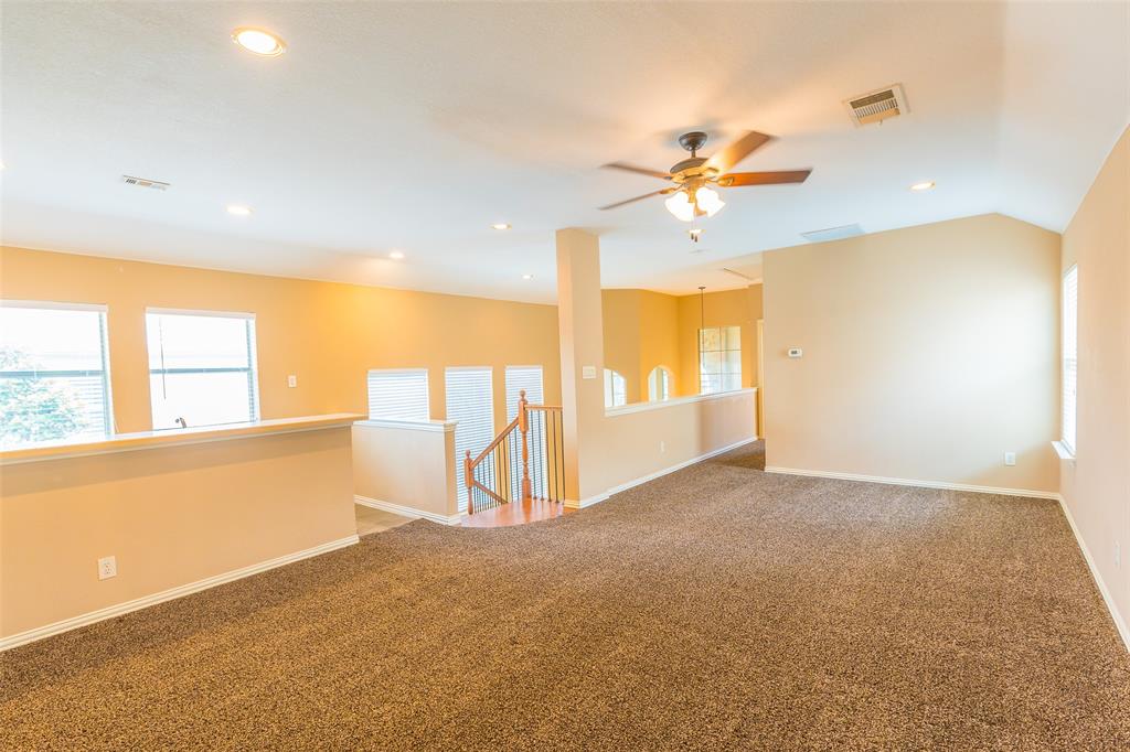 7804 Keechie Drive McKinney, TX 75070 - Photo 32 of 39 wooden floor in an empty room with a window