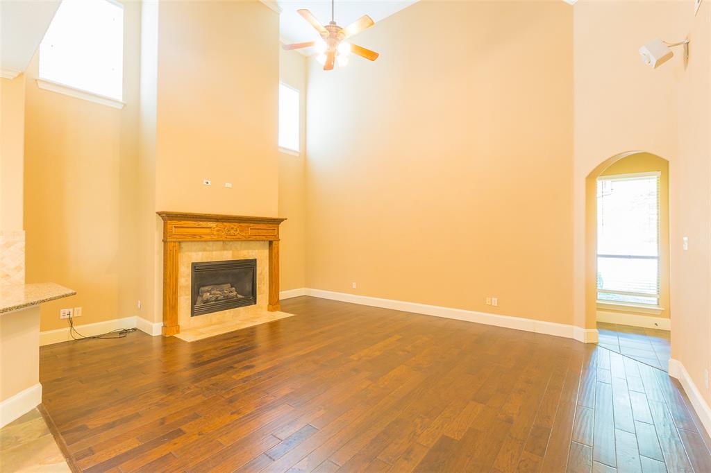 7804 Keechie Drive McKinney, TX 75070 - Photo 8 of 39 a view of empty room with wooden floor and fan