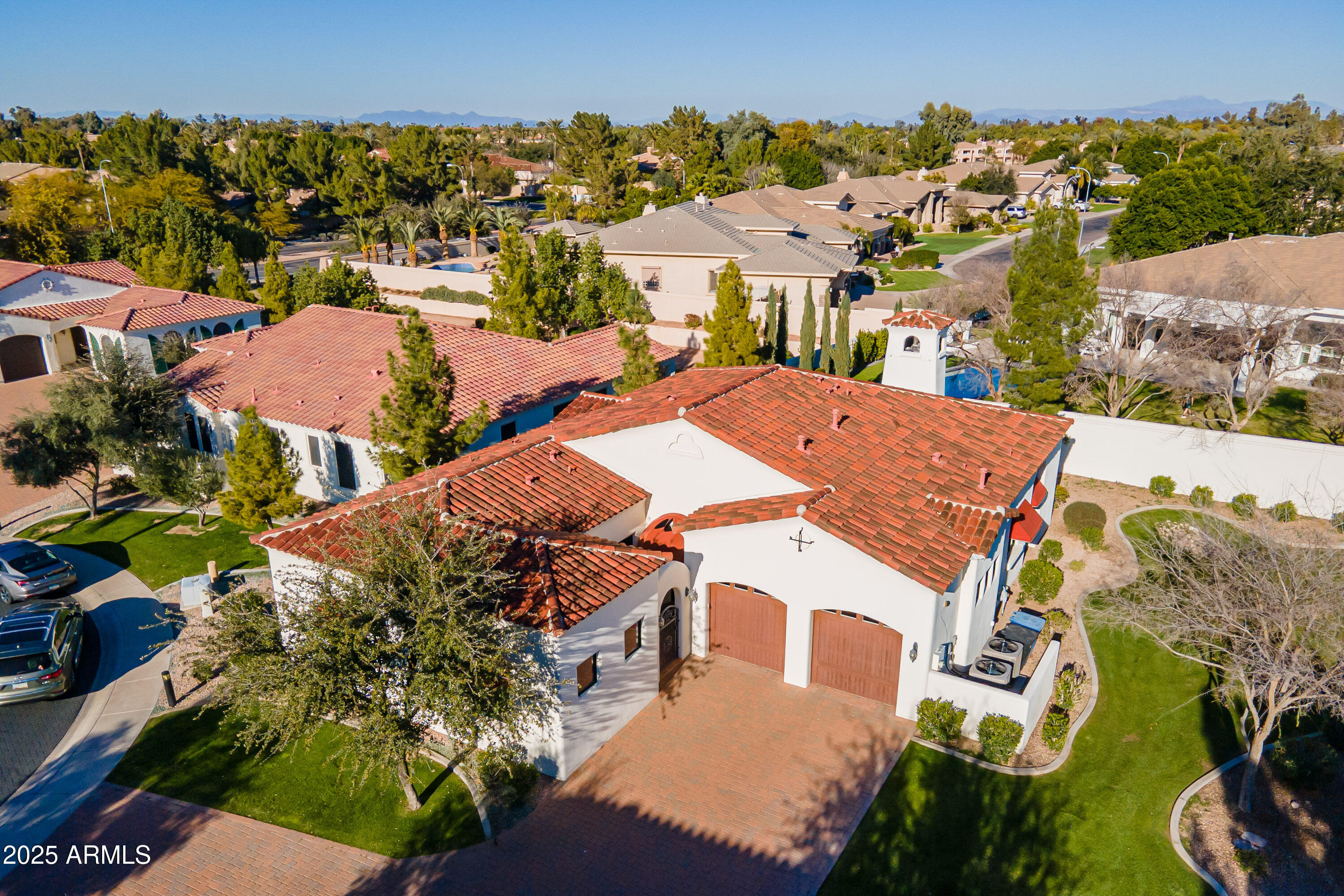 an aerial view of a house with a yard basket ball court and outdoor seating