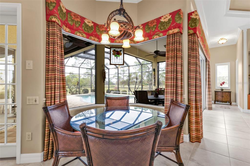 5021 Sable Key Circle Punta Gorda, FL 33955 - Photo 20 of 77 a dining room with furniture wooden floor and a chandelier