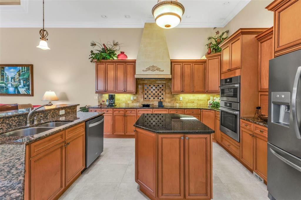 5021 Sable Key Circle Punta Gorda, FL 33955 - Photo 21 of 77 a kitchen with stainless steel appliances granite countertop sink stove and refrigerator