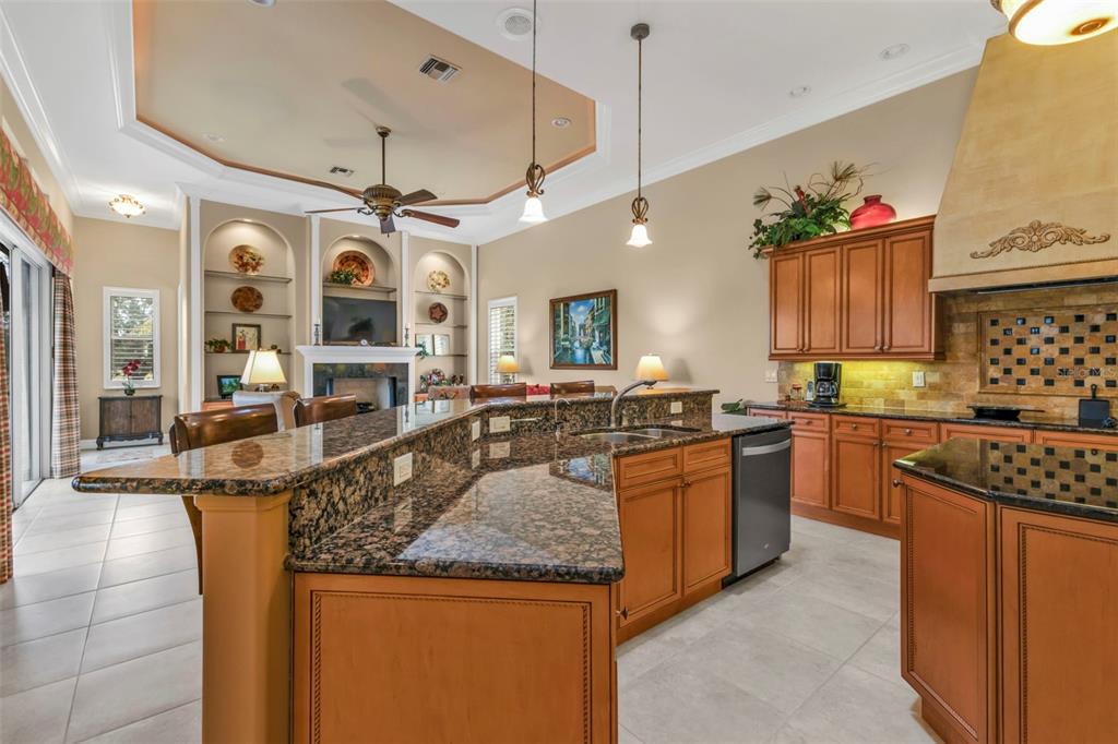 5021 Sable Key Circle Punta Gorda, FL 33955 - Photo 22 of 77 a kitchen with stainless steel appliances granite countertop a stove and a sink