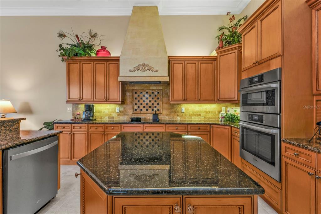 5021 Sable Key Circle Punta Gorda, FL 33955 - Photo 23 of 77 a kitchen with granite countertop stainless steel appliances stove microwave and sink