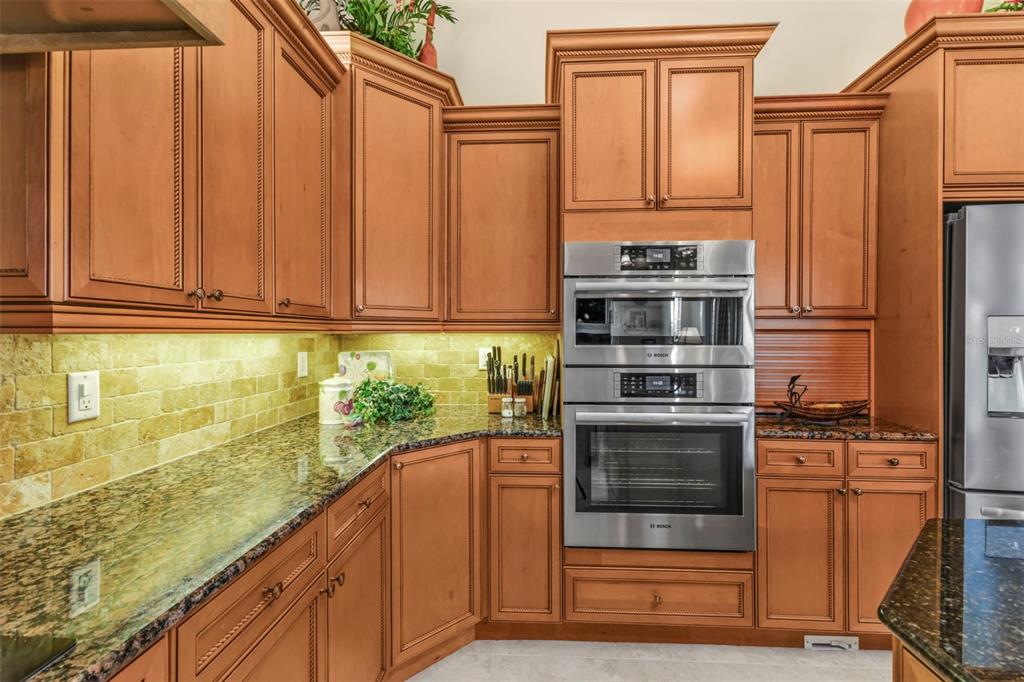 5021 Sable Key Circle Punta Gorda, FL 33955 - Photo 29 of 77 a kitchen with stainless steel appliances a stove and a refrigerator
