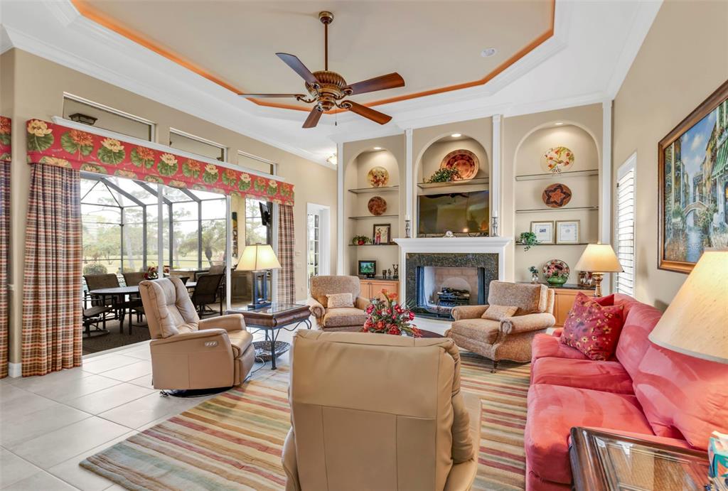 5021 Sable Key Circle Punta Gorda, FL 33955 - Photo 30 of 77 a living room with fireplace furniture and a large window