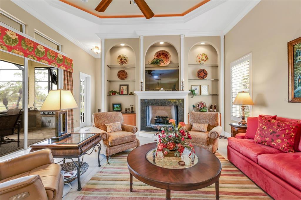 5021 Sable Key Circle Punta Gorda, FL 33955 - Photo 31 of 77 a living room with fireplace furniture and a large window