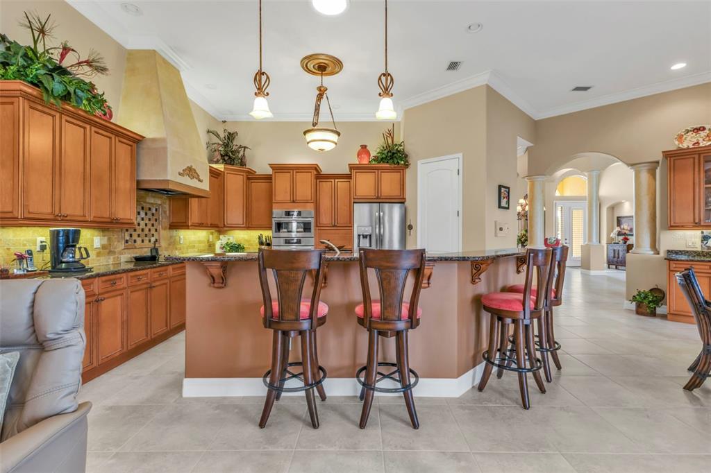 5021 Sable Key Circle Punta Gorda, FL 33955 - Photo 32 of 77 a room with granite countertop lots of chairs and furniture