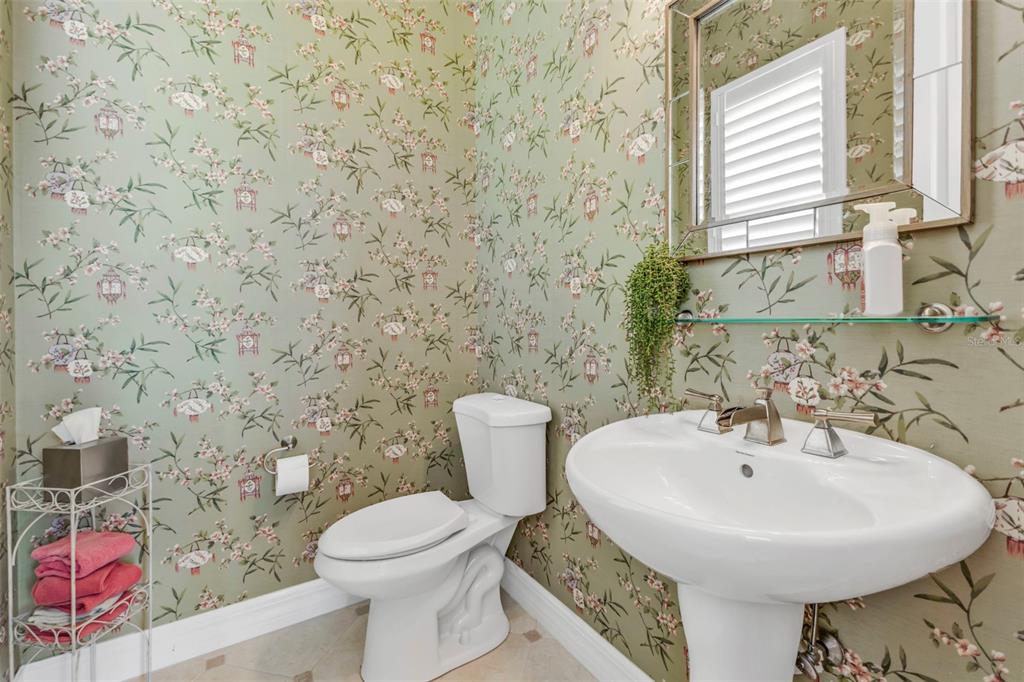 5021 Sable Key Circle Punta Gorda, FL 33955 - Photo 36 of 77 a bathroom with a sink a toilet and mirror