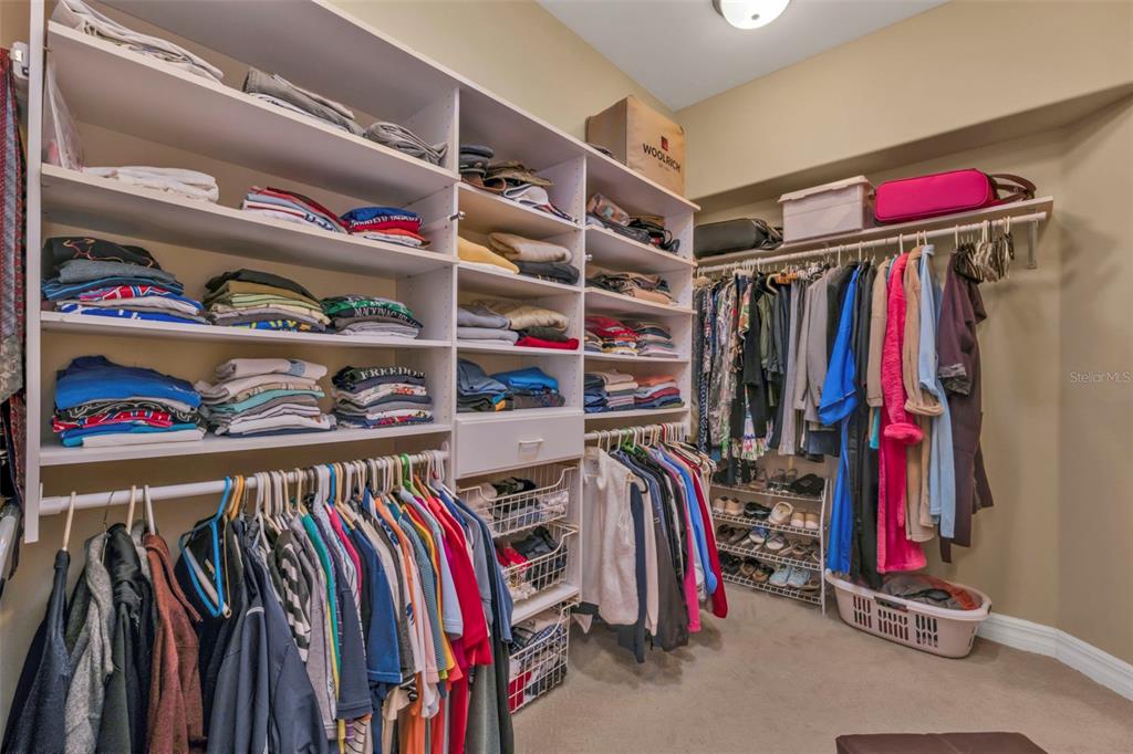 5021 Sable Key Circle Punta Gorda, FL 33955 - Photo 40 of 77 a view of walk in closet with clothes and shoes