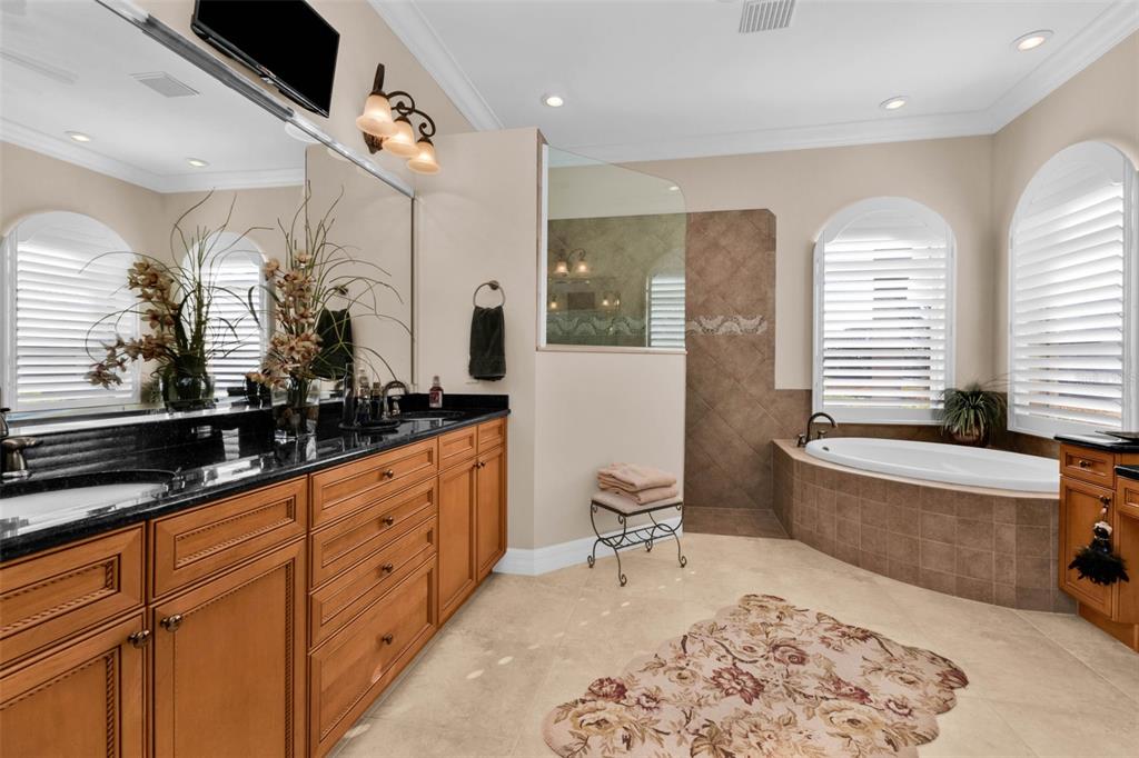 5021 Sable Key Circle Punta Gorda, FL 33955 - Photo 42 of 77 a large spacious bathroom with a tub sink and mirror