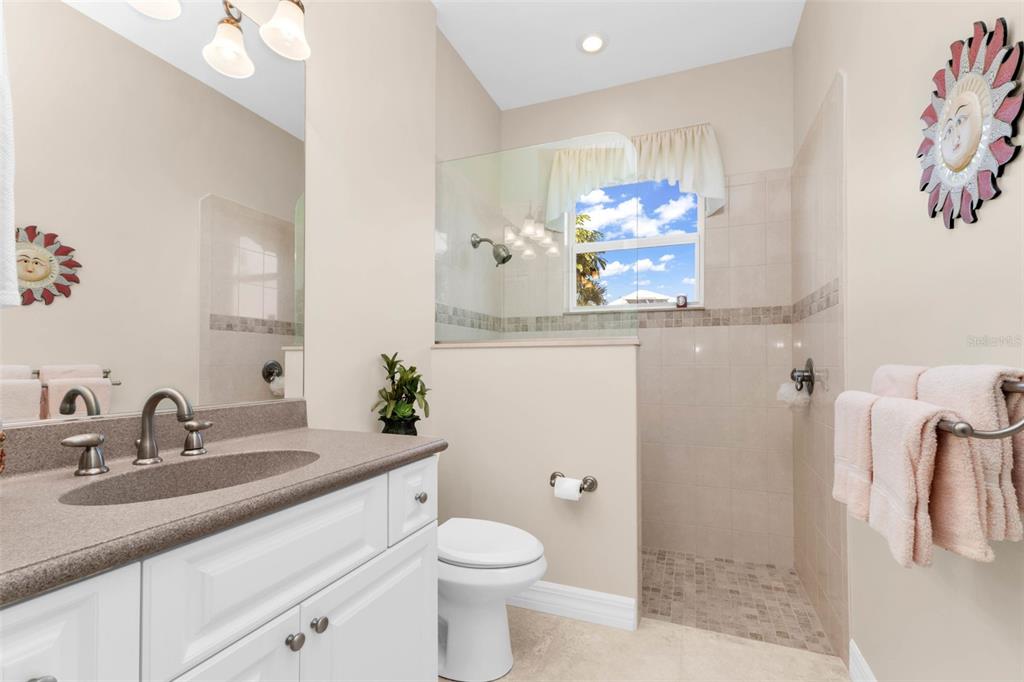 5021 Sable Key Circle Punta Gorda, FL 33955 - Photo 52 of 77 a bathroom with a sink a mirror and a toilet