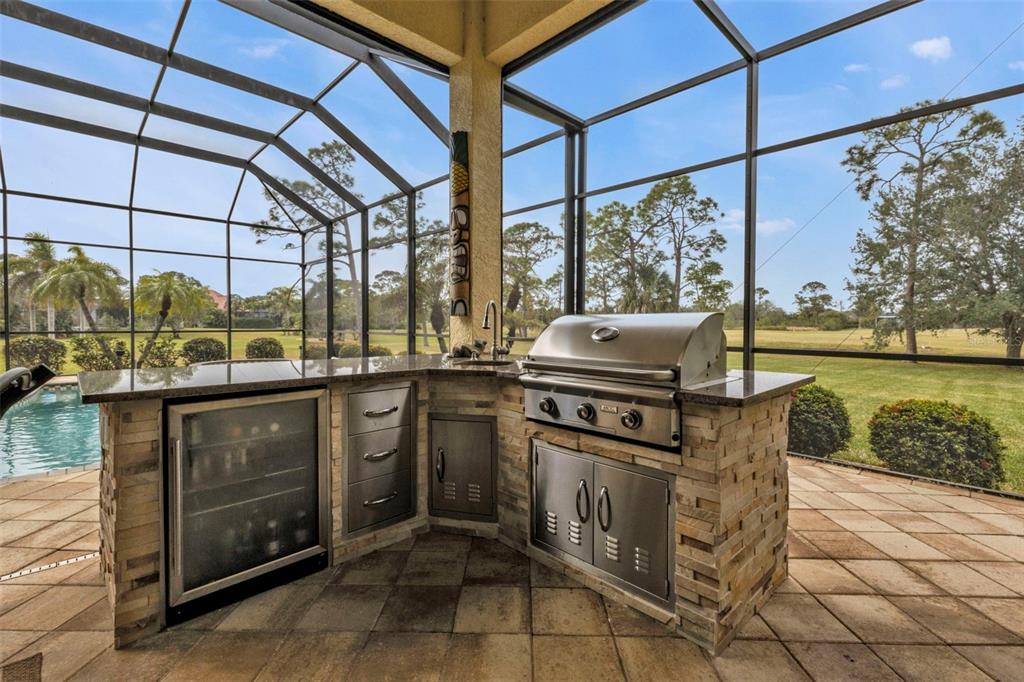 5021 Sable Key Circle Punta Gorda, FL 33955 - Photo 58 of 77 a kitchen with stainless steel appliances granite countertop a sink and a counter