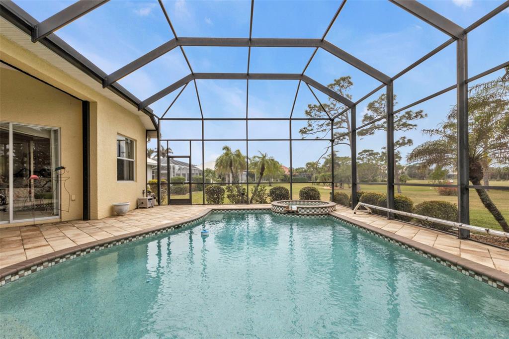 5021 Sable Key Circle Punta Gorda, FL 33955 - Photo 66 of 77 a swimming pool with outdoor seating